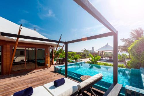 Al Hamra Village Complejo | The Ritz-Carlton Ras Al Khaimah, Al Hamra Beach