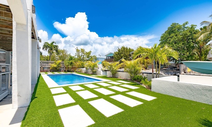 Cutthroat Harbor Estates Casa | The Salty Sailfish: Live the Keys Life, Stunning Canal Front Home, Pool, Dock & Dog-Friendly Bliss!