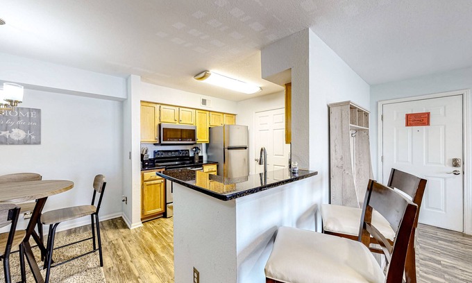 Indian Bayou Condominio | Third-floor condo with balcony, pool, gym & central AC - 1/2 mile to the beach