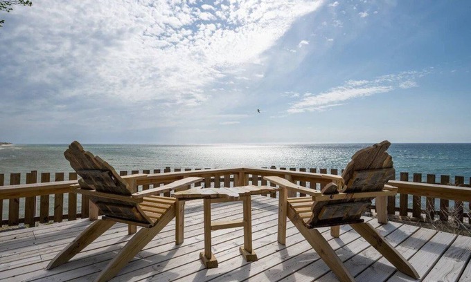 Mears Casa | This charming vacation home sits directly on Lake Michigan and it delivers!