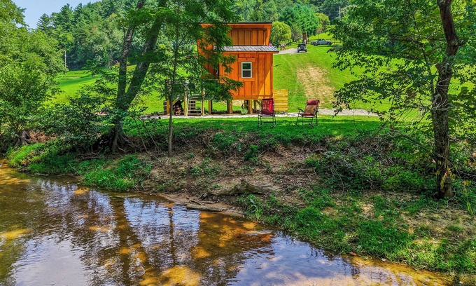 Hillsville Cabina | Tiny cabin sits by a bubbling, stocked creek. Pet friendly for a fee, hot tub