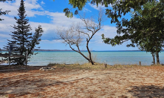 Rapid City Casa | Torch Lake with Sandy beach frontage