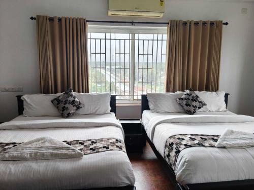 Kozhikode Hotel | Townhouse Kozhikode Beach Formerly Point Avenue