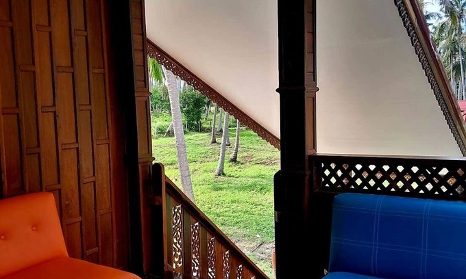 Thong Chai Casa | Traditional Thai wooden house on stilts set in a coconut orchard near the beach