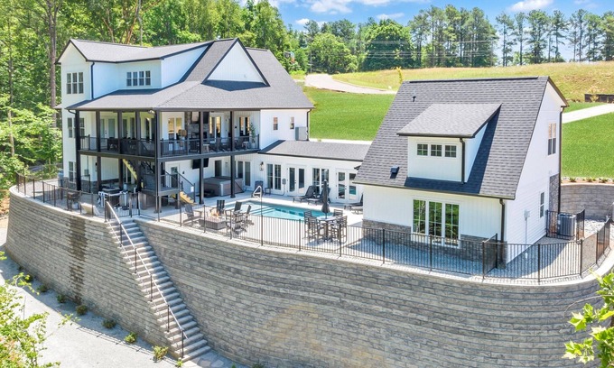 Moneta Casa | Tranquil Shores Estate, Luxury Lakefront Compound w/ Heated Salt Pool, Hot Tub, Dock!