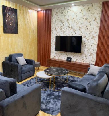 Lome Villa | Two bedroom living room single courtyard villa