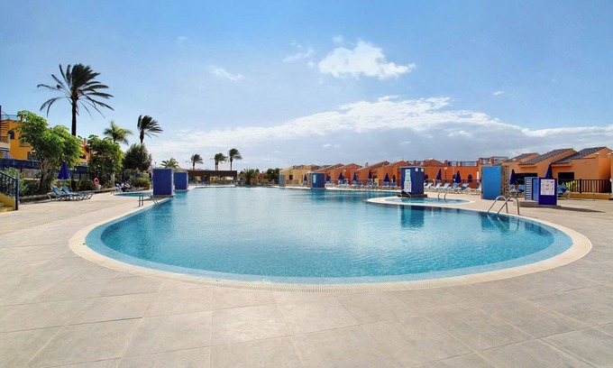 Costa Meloneras Apartamento | Apartamento de vacaciones 'Meloneras 1' con piscina compartida, Wi-Fi y aire acondicionado