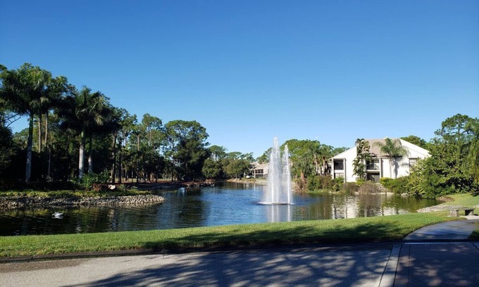 Biggar Condominio | Vacation in the Forest CC heated pool view of golf course near beaches airport