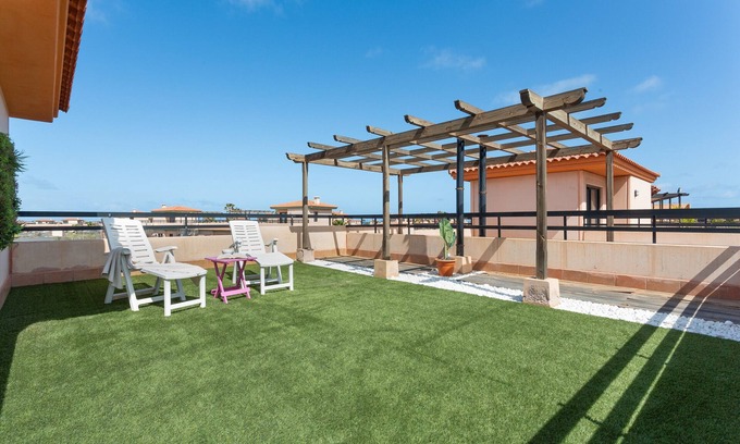 La Oliva Apartamento | Vacaciones 'Punta Calma' con vistas al mar, piscina compartida y Wi-Fi