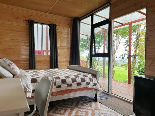 Ahascragh Otro | Valley view cabin in the woods on a farm