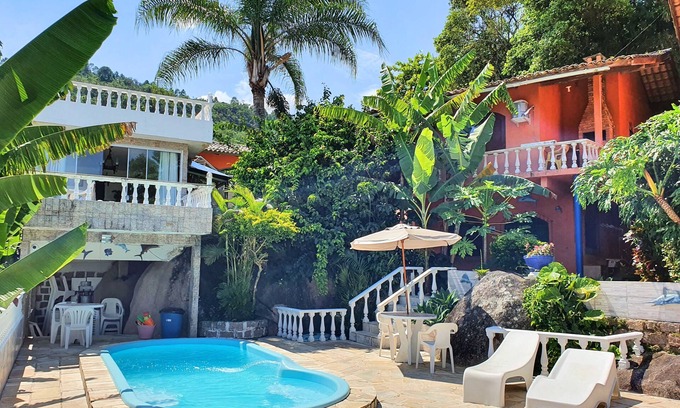 Florianopolis Cabaña | Veranda - Charming 3-bedroom Cottage with AC in Peacefull Daniela Florianopolis