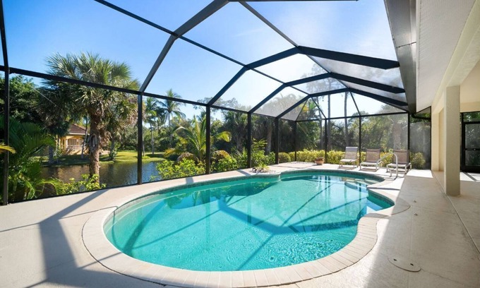 Palm River Estates Casa | Vibrant home close to best beach parks and shops backyard pool with a lake