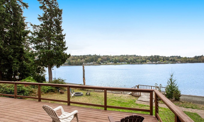 Agate Casa | Vibrant waterfront home with large deck, woodstove & striking sunset views