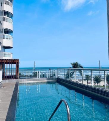 Caicara Apartamento | Vila Caiçara Apto à beira mar! Novinho