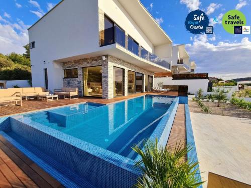 Razanj Villa | Villa Ramarin III with infinity heated pool, jacuzzi and sauna by the sea in Rogoznica