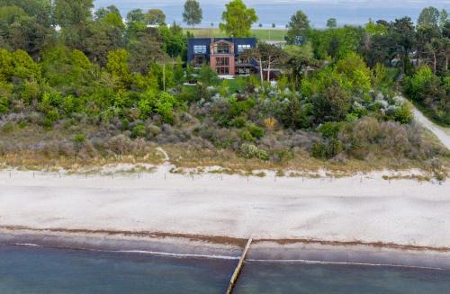 Hohe Dune Apartamento | Villa Schmidt - Strandhaus direkt am Meer mit Sauna, Sport und Dünengarten I