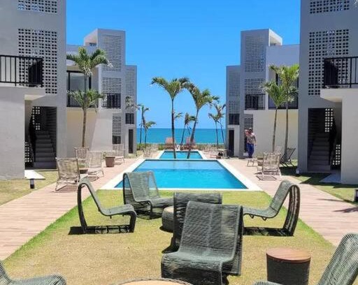 Itacimirim Apartamento | Village 3 quartos frente mar em Itacimirim.