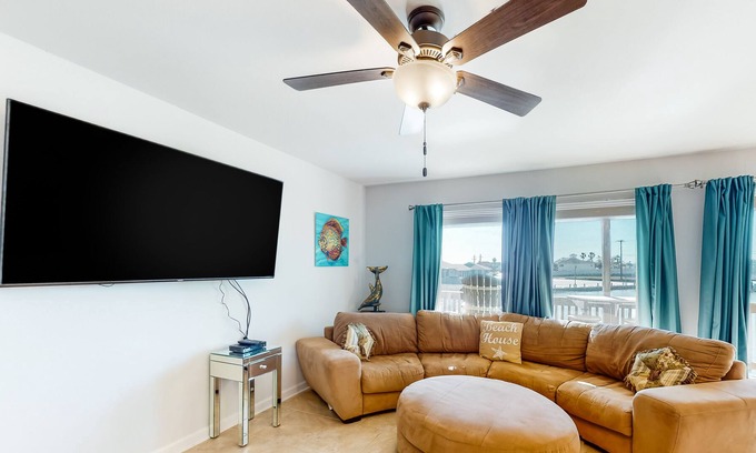 Harbor Oaks Casa | Waterfront condo with balcony, private boat slip, fishing pier, pools, & tennis