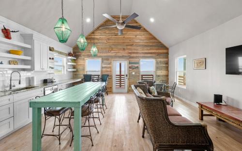 Flour Bluff Casa | Waterfront Escape w Views Shared Pool Boat Dock Orange Crush by AvantStay