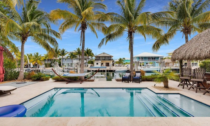 Venetian Shores Casa | Waterfront Getaway in Venetian Shores – Pool, Hot Tub, Tiki Hut & More