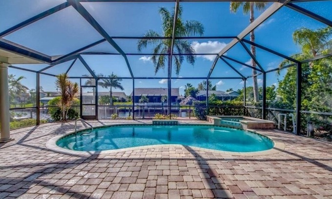 Caloosahatchee Casa | Casa tranquila frente al mar, exposición al sur, piscina climatizada con jacuzzi