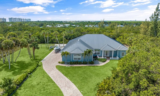 Fort Pierce Shores Casa | Waterfront home/ steps to the beach/ private dock/ heated pool/spa