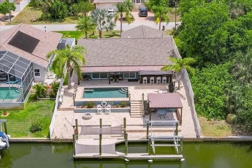 Palm Harbor Casa | Waterfront Retreat with Pool Tiki Bar & Boat Dock