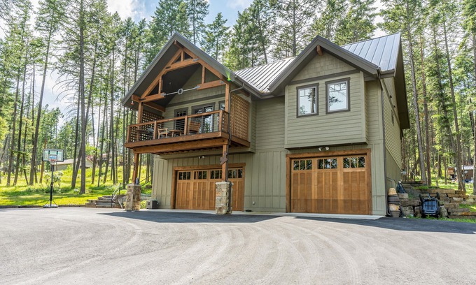 Lakeside Casa | Wilderness retreat with a large deck, grill, updated interior, fireplace, and AC