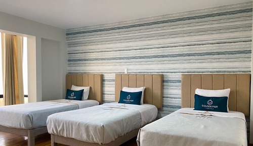 Habitación triple superior, 3 camas individuales, vistas parciales al mar