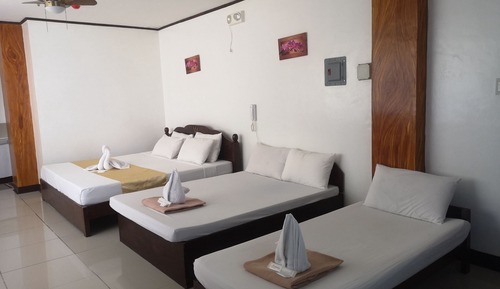 Habitación superior, varias camas
