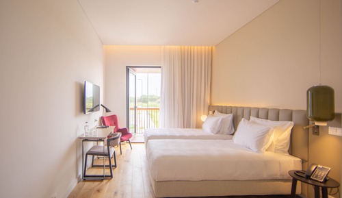 Habitación superior con 2 camas individuales, vistas a la ciudad