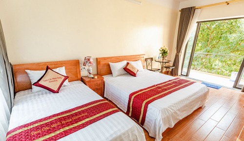 Habitación Deluxe, varias camas, patio, vistas al jardín