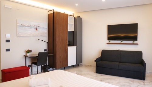 Habitación cuádruple Deluxe, 1 cama de matrimonio grande con sofá cama, no fumadores, vistas al mar
