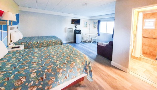 Habitación Grand doble, varias camas, frigorífico y microondas