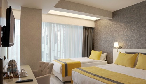 Habitación estándar con 2 camas individuales, varias camas
