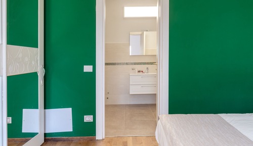 Habitación Elite con 1 cama doble o 2 individuales