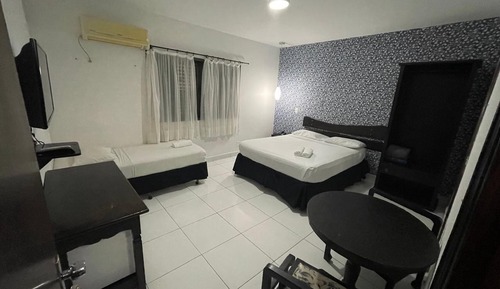 Habitación triple ejecutiva