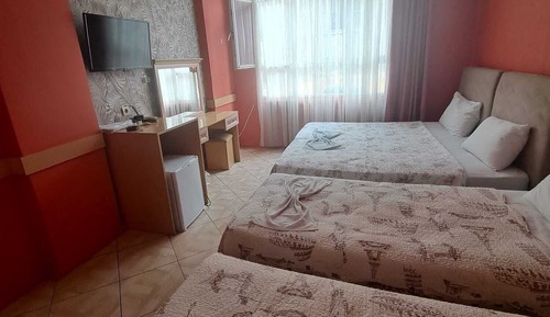 Habitación triple familiar, varias camas