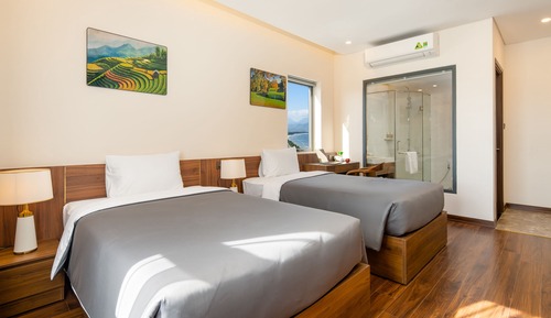 Habitación Deluxe con 2 camas individuales, 1 habitación, vistas parciales al mar (Suite Twin)
