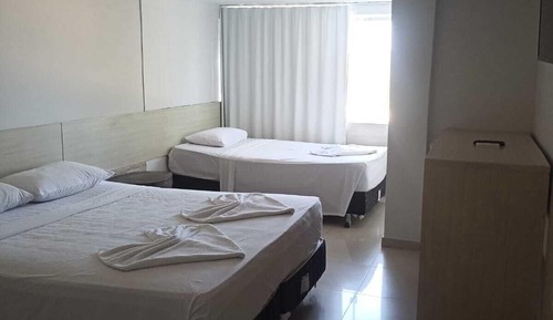 Habitación triple, vistas al mar