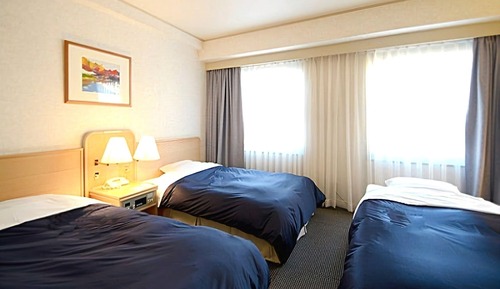 Habitación triple, fumadores
