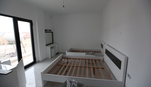 Habitación triple, cocina básica