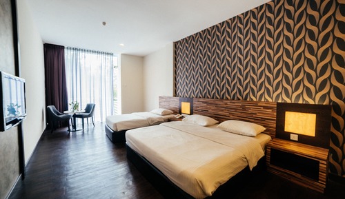 Habitación triple familiar, vistas al jardín