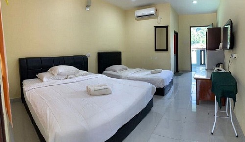 Habitación triple, vistas al mar