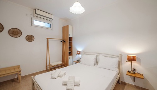 Superior Suite with private terrace and Pontikonisi island view