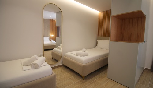 Habitación cuádruple Deluxe, vistas a la ciudad, junto a la playa