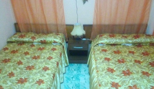 Habitación triple, varias camas