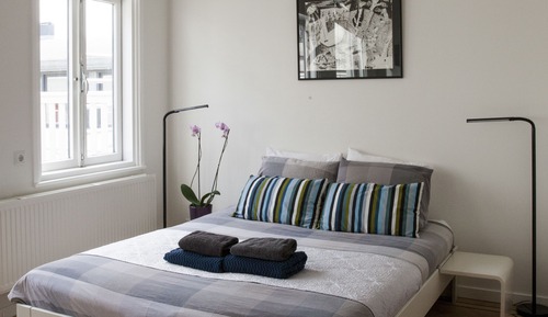 Habitación cuádruple Deluxe, 1 cama de matrimonio con sofá cama, balcón, vistas a la ciudad