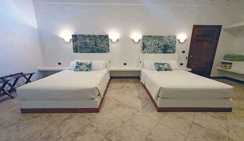 Suite junior, 2 camas de matrimonio, vistas al jardín