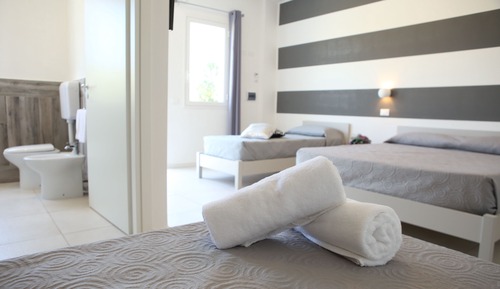 Habitación cuádruple Deluxe, vistas al jardín